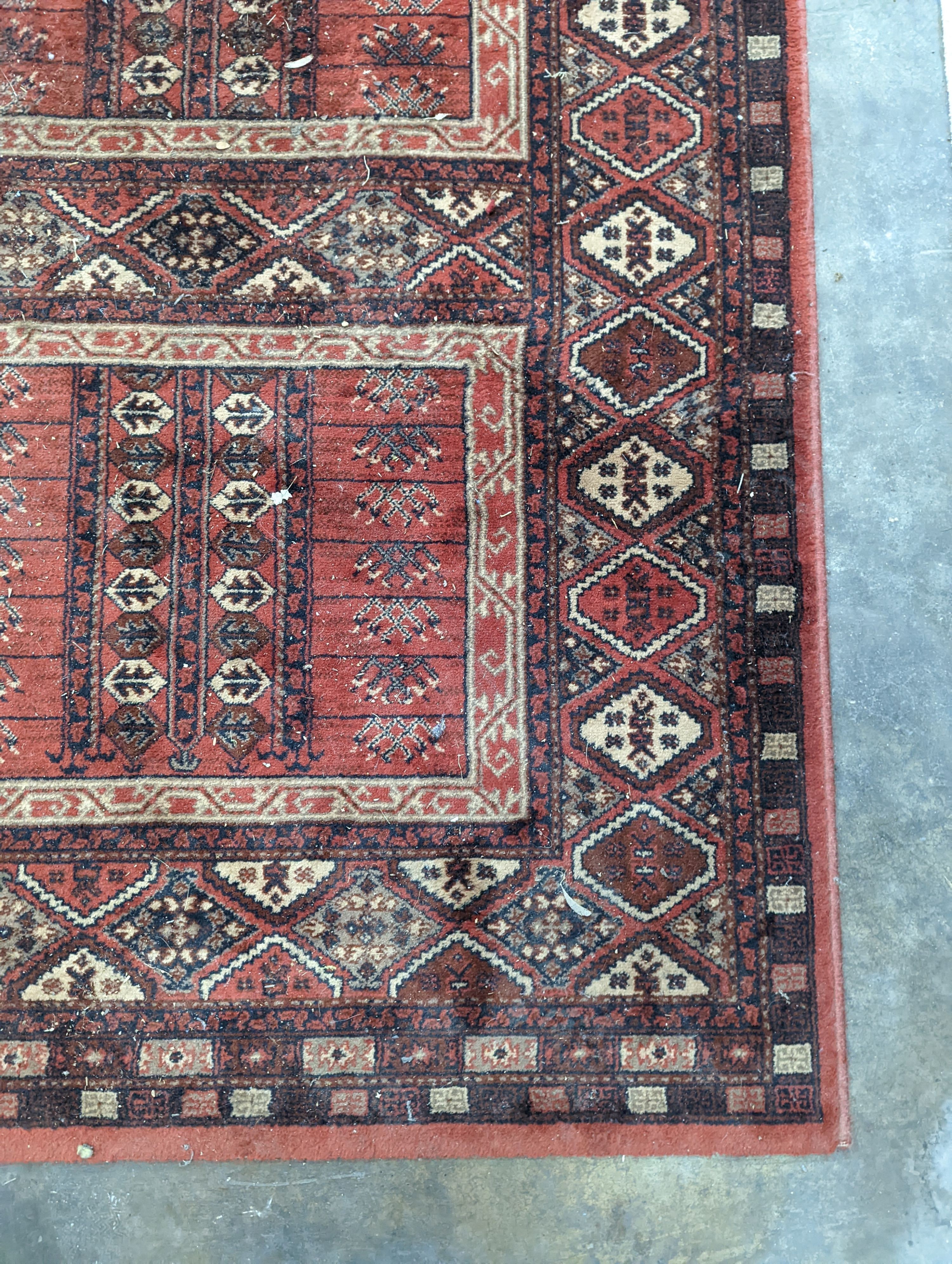 A Caucasian red ground rug, 190 x 136cm